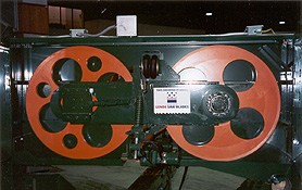 General Assembly of 36" x 1-1/2" Face (for 2" blade) Horizontal Bandmill. Both 36" dia. bandwheels are made from steel, are stress relieved, fully machined, crowned, high speed dynamically balanced for vibration free use and painted safety orange. Wheels are generally sold in matched pairs with the driver being heavier than the idler (keeping the external inertia of the wheels in proportion)